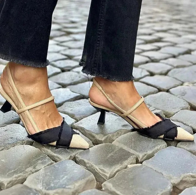Women's apricot and black colour block stiletto heel sandals with pointed toe and buckle strap.