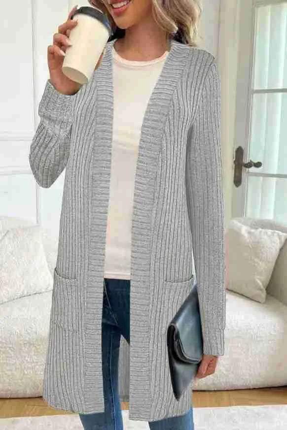 Long sleeve loose-fit knitted cardigan jacket with pockets in wine red colour.