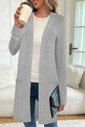 Long sleeve loose-fit knitted cardigan jacket with pockets in wine red colour.