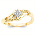 Yellow gold women's geometric diamond ring with a small inlaid zircon stone, shown on a copper band.