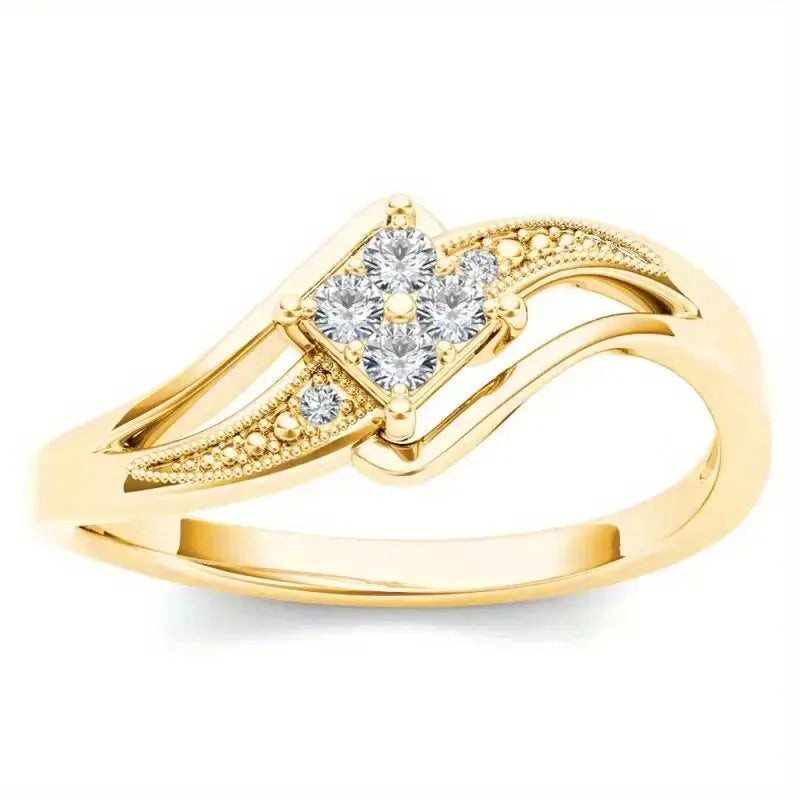 Yellow gold women's geometric diamond ring with a small inlaid zircon stone, shown on a copper band.