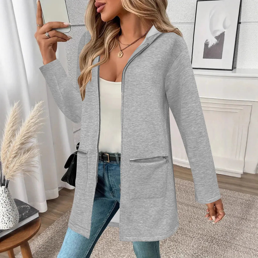 Grey loose-fit women's mid-length cardigan coat with pockets on a hanger.