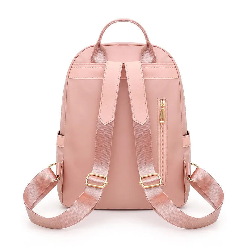Soft black nylon women's casual backpack with double straps, external pocket, and internal organisers.