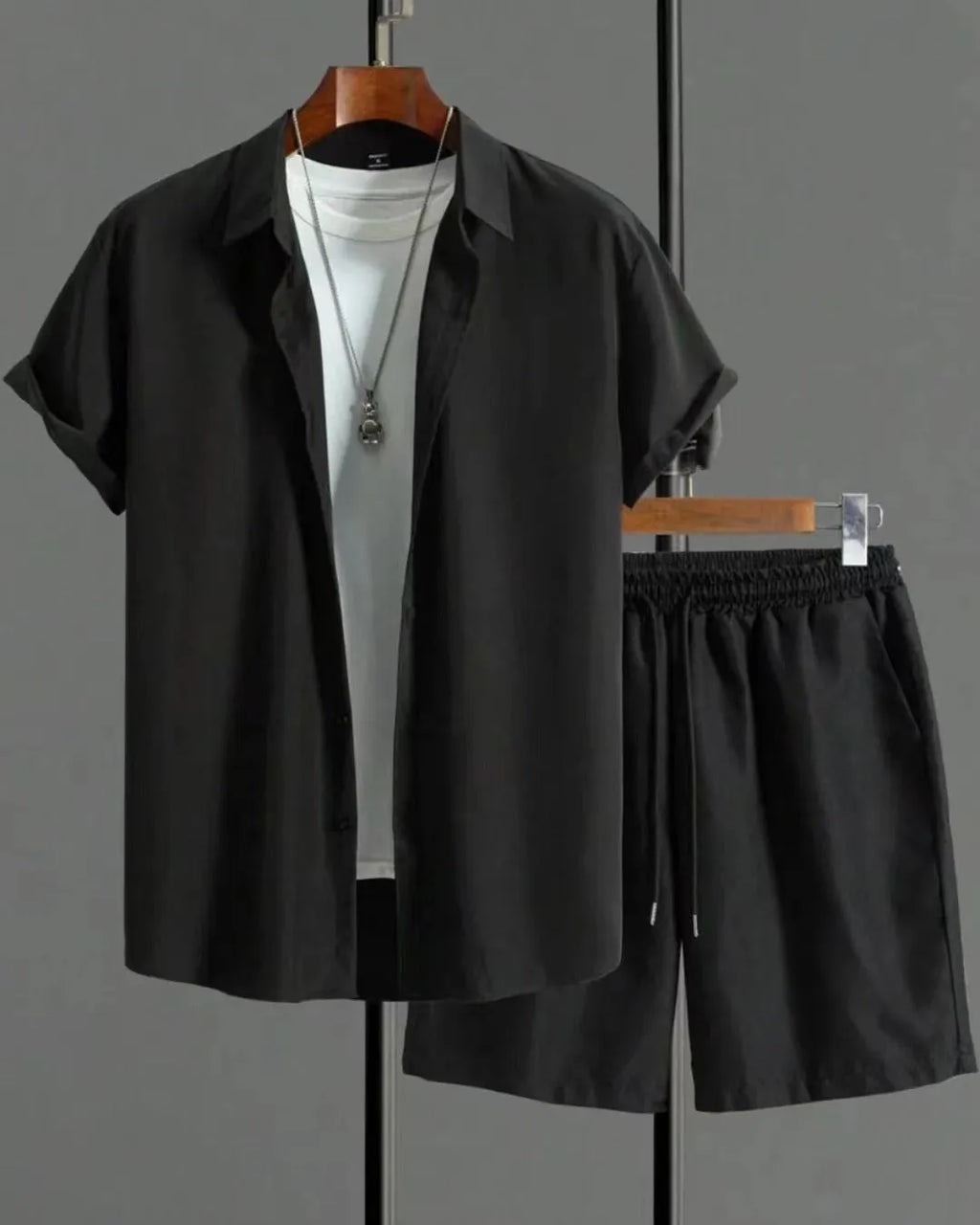 Man wearing a Jacquard short sleeve suit jacket and matching shorts in a solid colour.