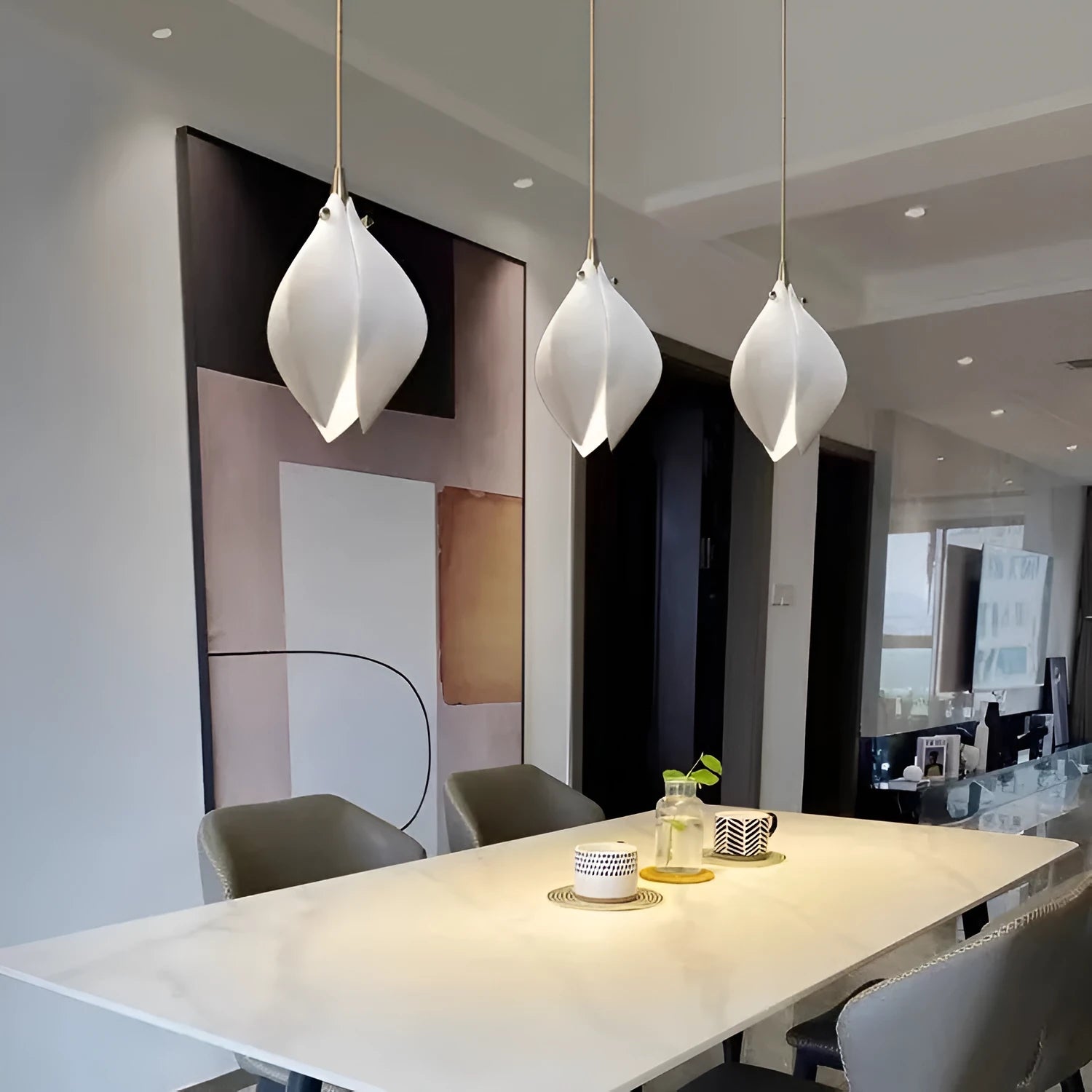 Ceramic magnolia petal shaped single pendant light with minimalist design.
