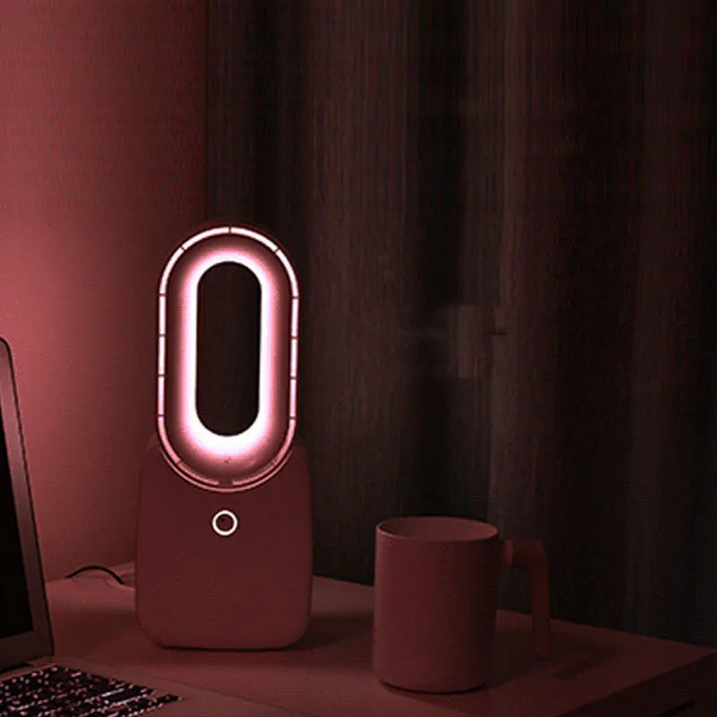 White USB charging portable mini bladeless fan with touch screen control on a desk