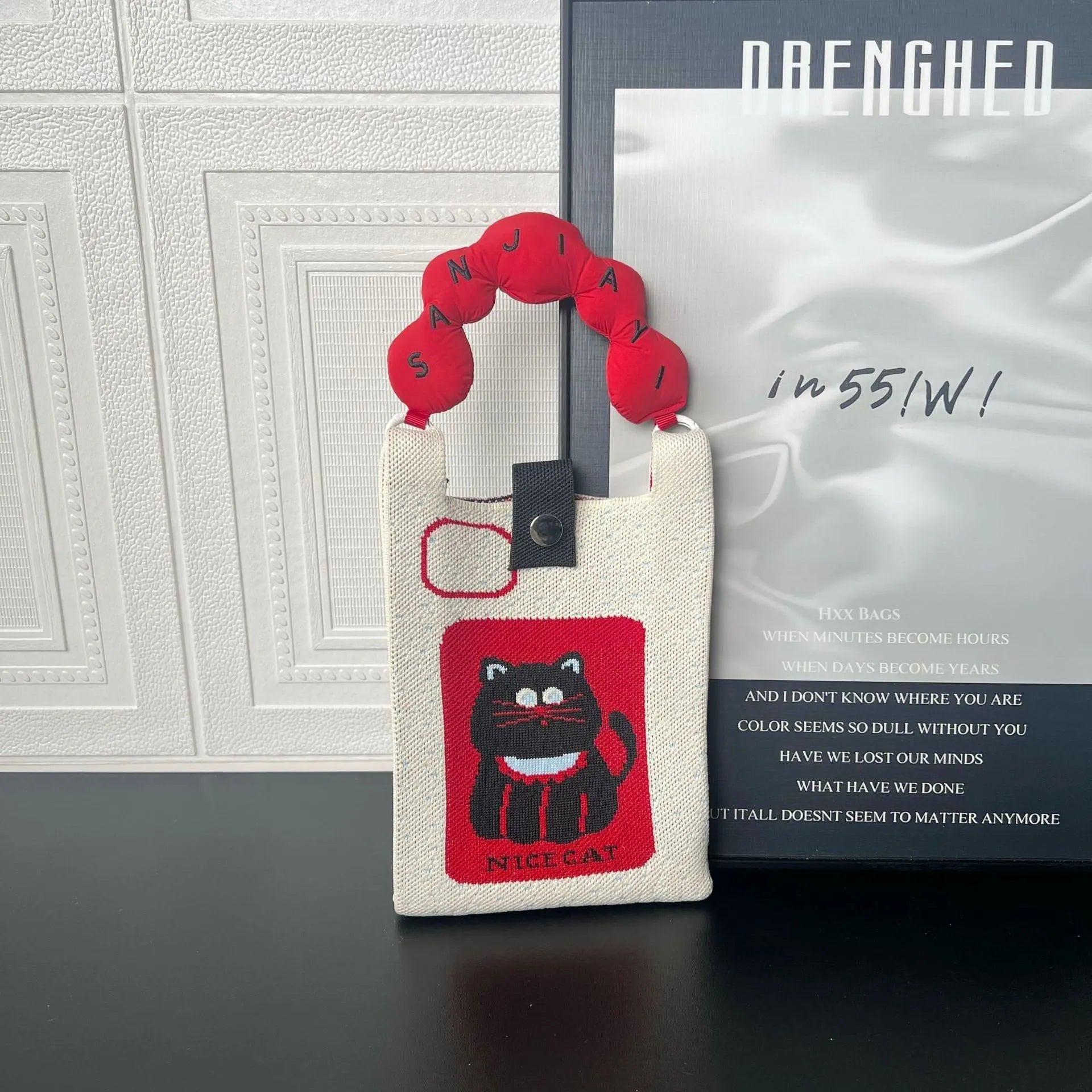 Cartoon knitted messenger bag with woven design and single shoulder strap
