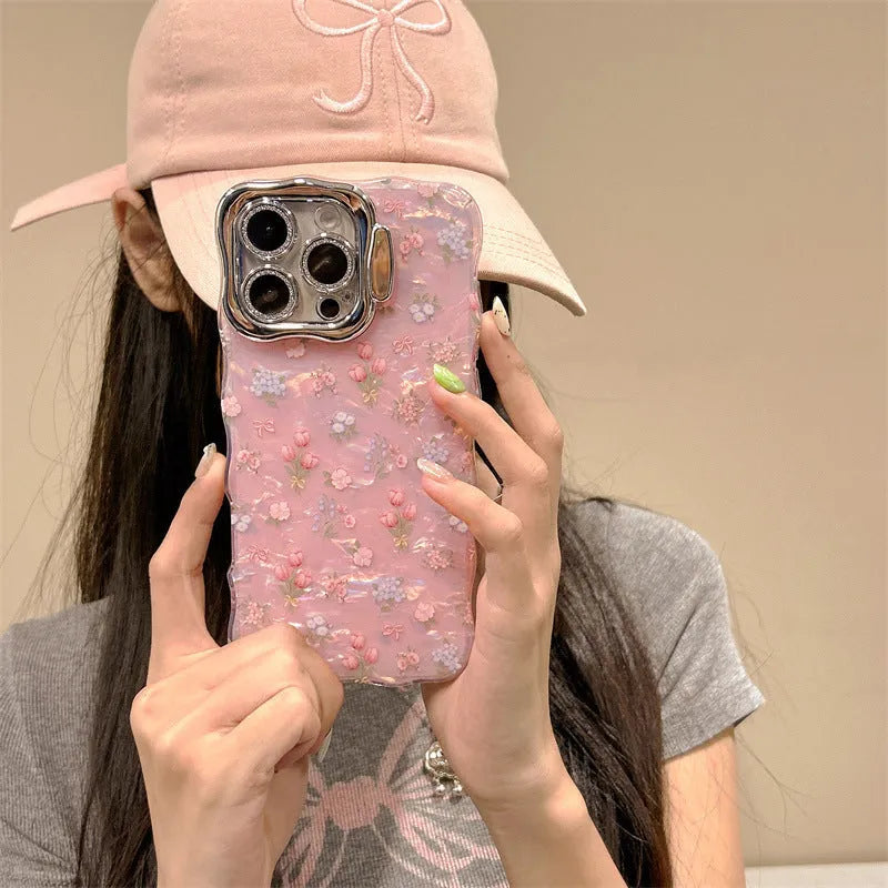 Wave pink acrylic iPhone case with embossed floral shell pattern and invisible brackets