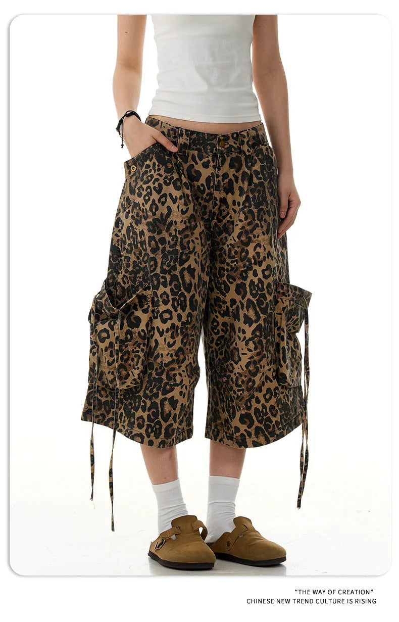 Women's high-waisted leopard print cropped trousers with a loose straight leg and button fly.
