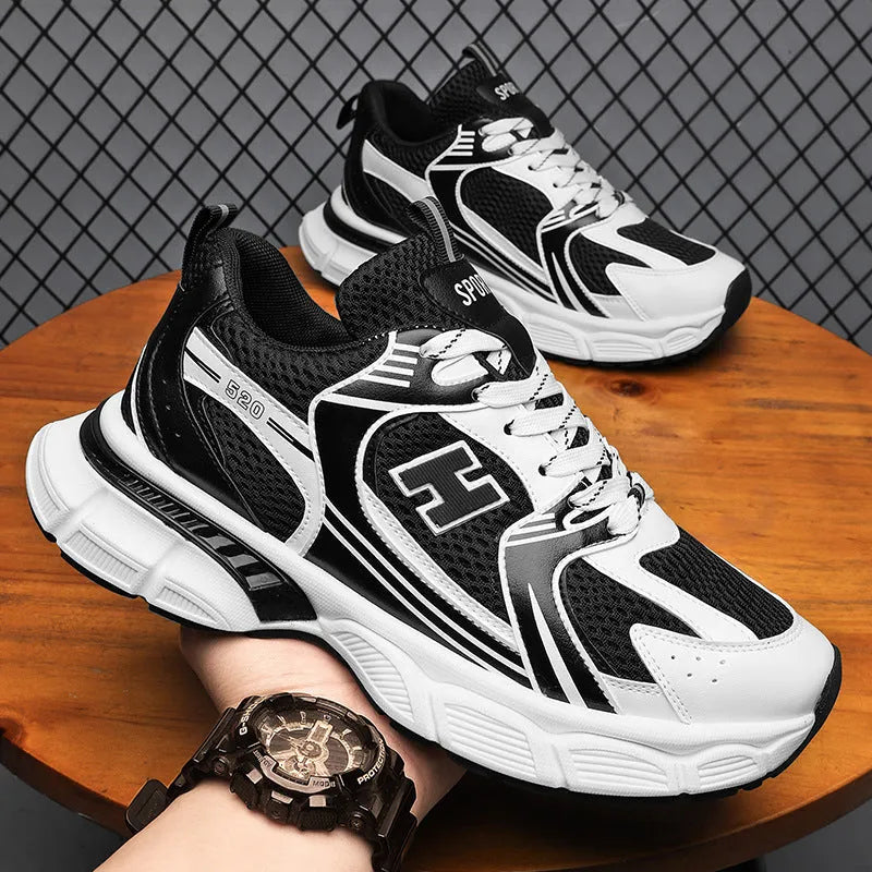 Men's mesh running shoes in black, white orange, and white and grey colours with plastic soles