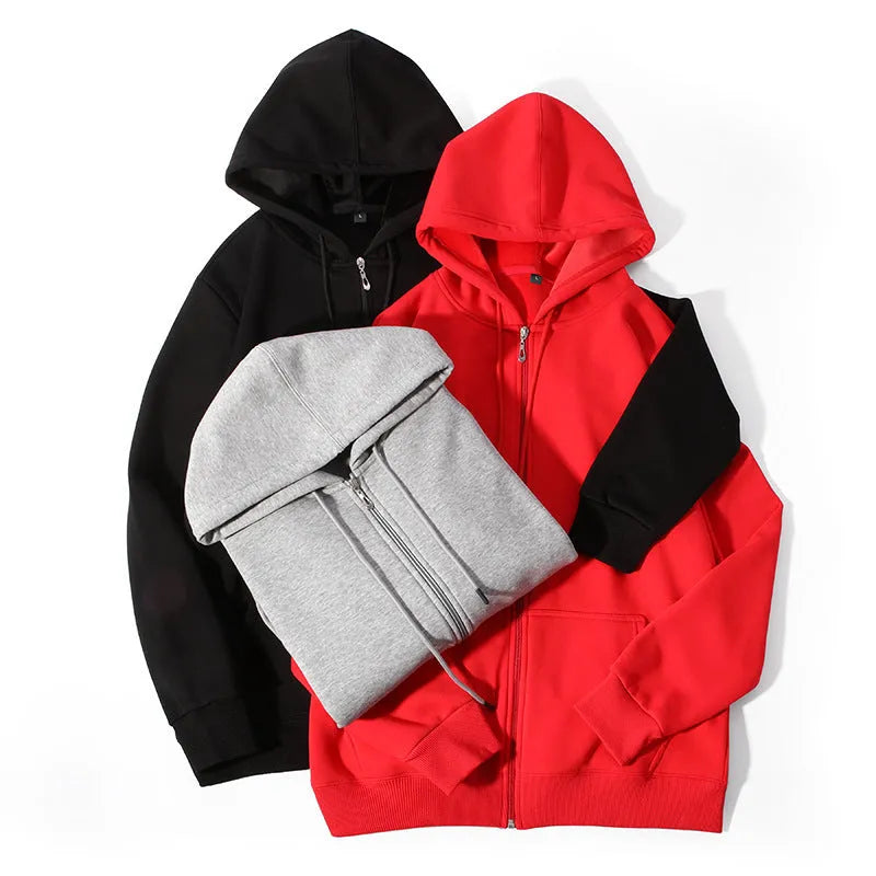A beige men's heavyweight hooded zip-up sweater showing kangaroo pockets and a loose fit on a man.
