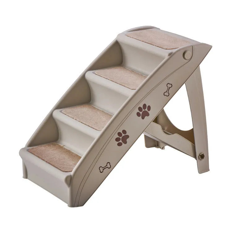 Foldable plastic pet stairs with non-slip mats in beige colour next to a sofa.