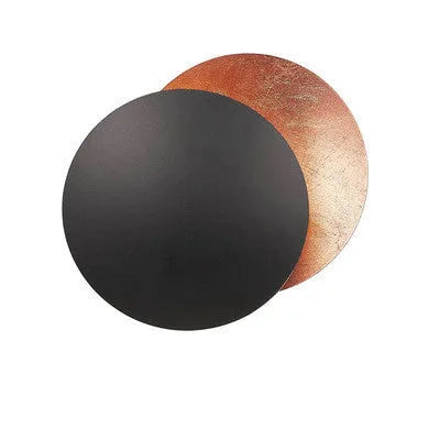 Round solar eclipse design wall lamp with iron construction in black and brass finish