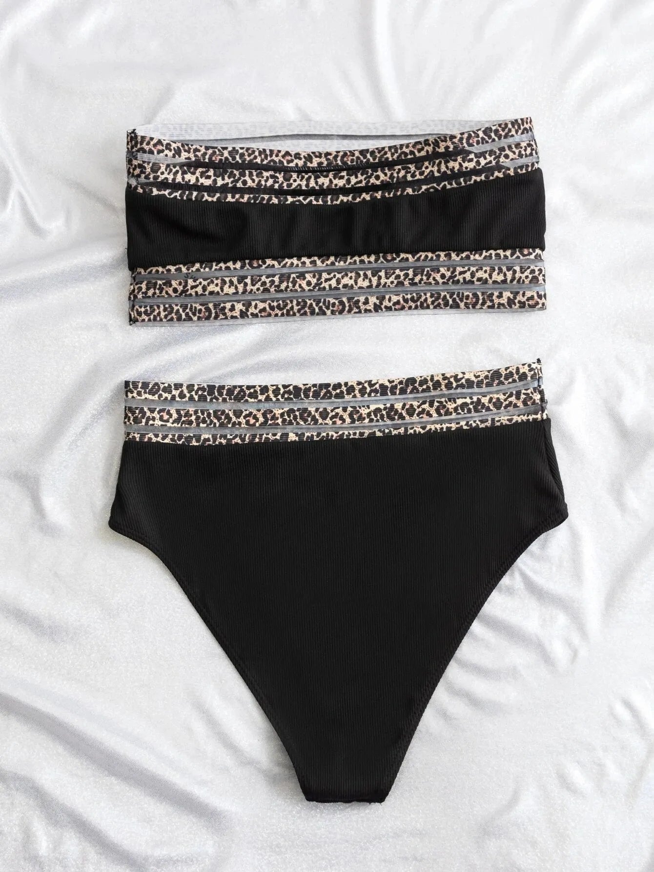Black strapless leopard print bikini set with separate bra and briefs on a mannequin.