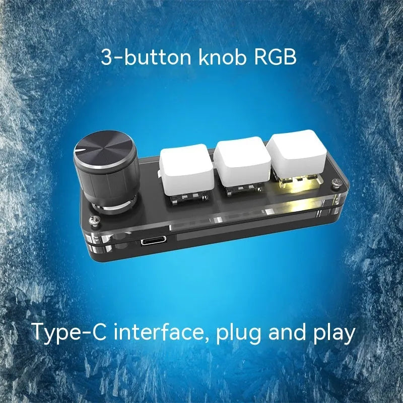 Black and white custom USB macro keyboard with RGB backlighting on a desk