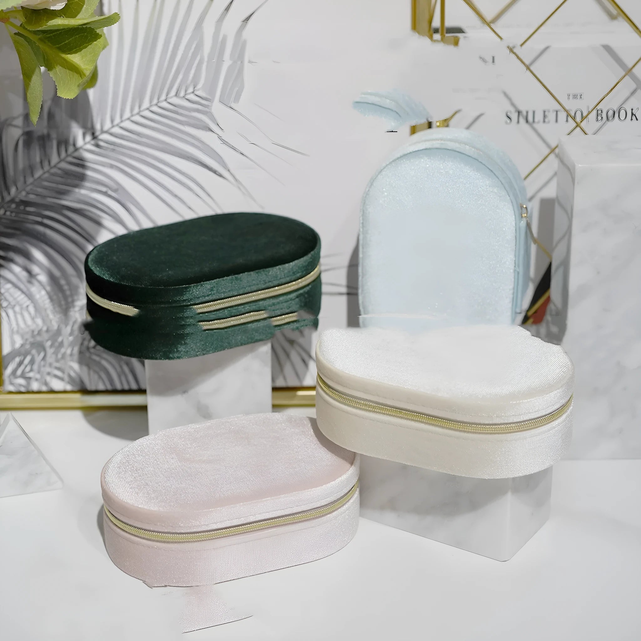 Oval velvet jewellery storage box in beige with flannel lining, showing 15cm by 10cm dimensions.