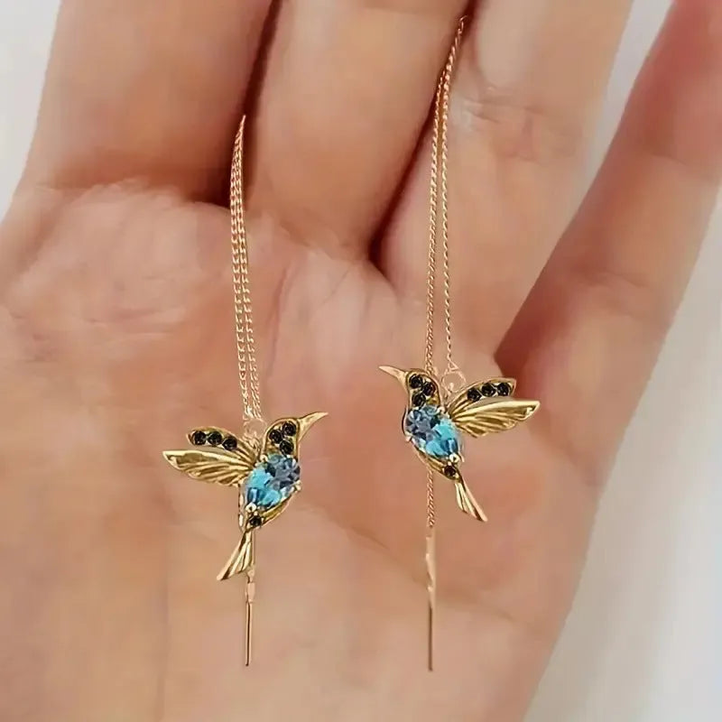 Women's long hanging earrings with bird motif in red, blue, or red lvzuan electroplated alloy.