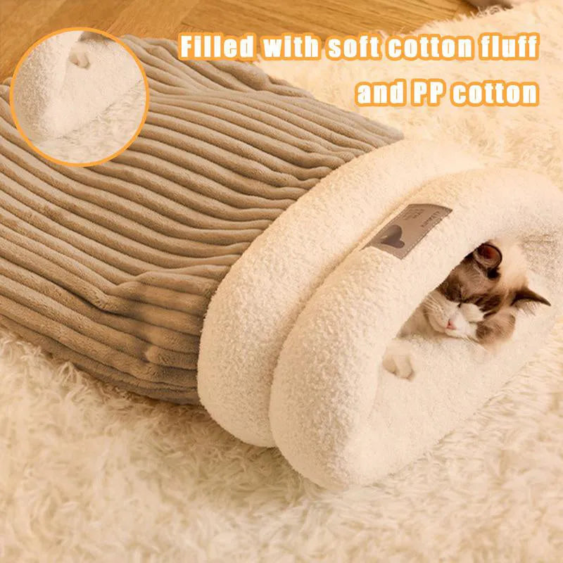 Brown semi-enclosed plush pet sleeping bag or cat nest bed on a wooden floor.