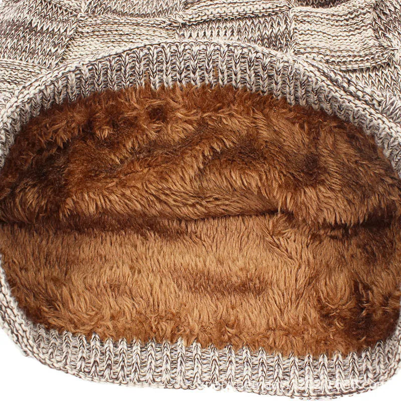 Wool knitted beanie hat in khaki, dome top, brimless style on model