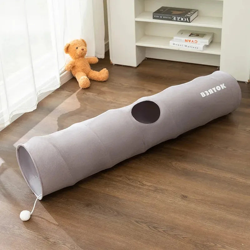 Collapsible cat tunnel with plush ball in brown or grey, showing foldable steel wire frame and suede fabric