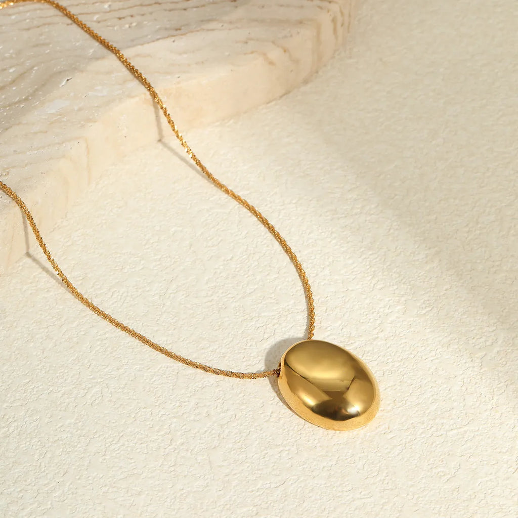 Gold geometric pendant necklace on adjustable 41-50cm chain with stainless steel construction