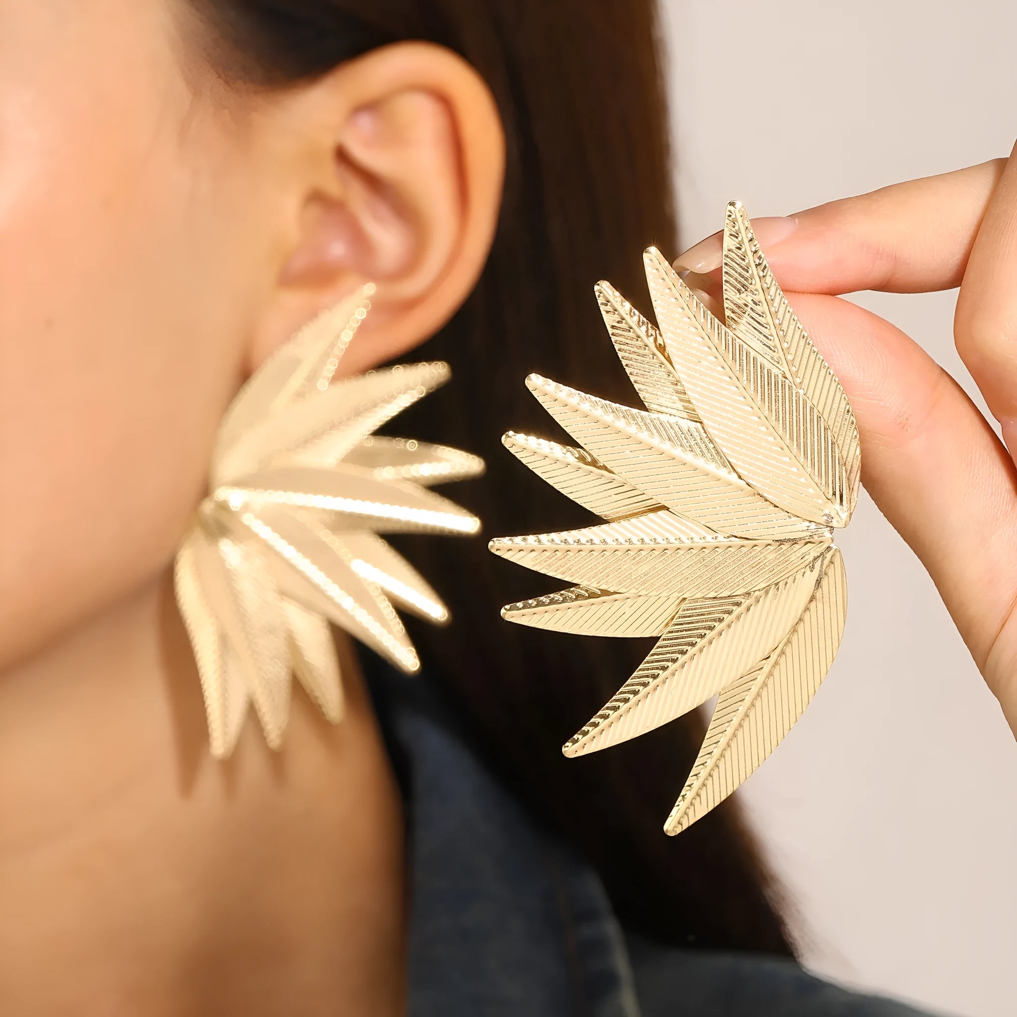Gold and white alloy patch earrings with leaves shape design