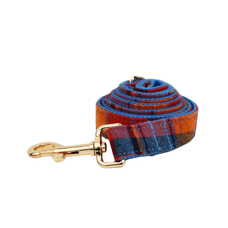 Blue velvet plaid dog collar with integrated hand-holding rope and leash set on cloth material