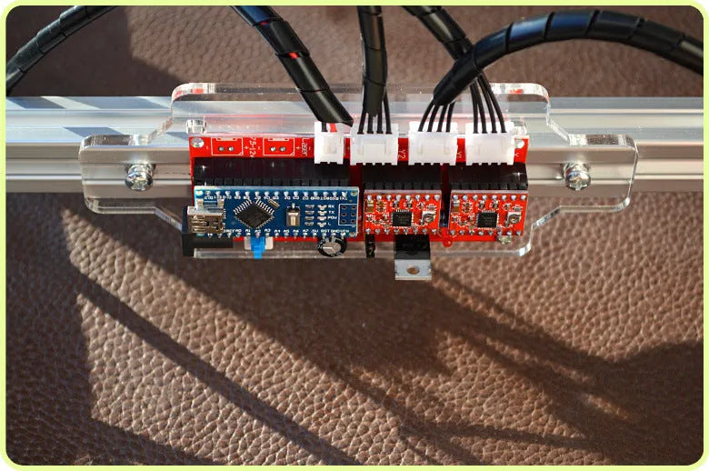 Miniature 3000mW laser engraving machine with a 400x300mm base plate for desktop marking.