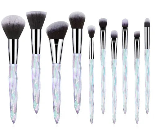 Set of ten clear crystal handle makeup brushes with diamond shank detail and artificial fibre bristles.