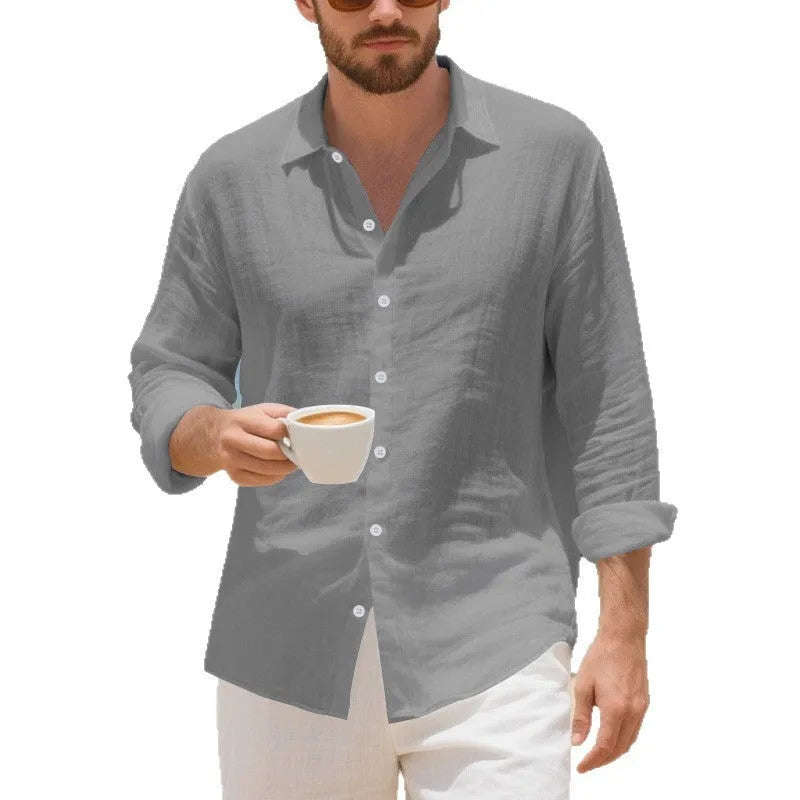 Man wearing a loose-fit light blue linen casual shirt with button-down front, showcasing its relaxed American style.