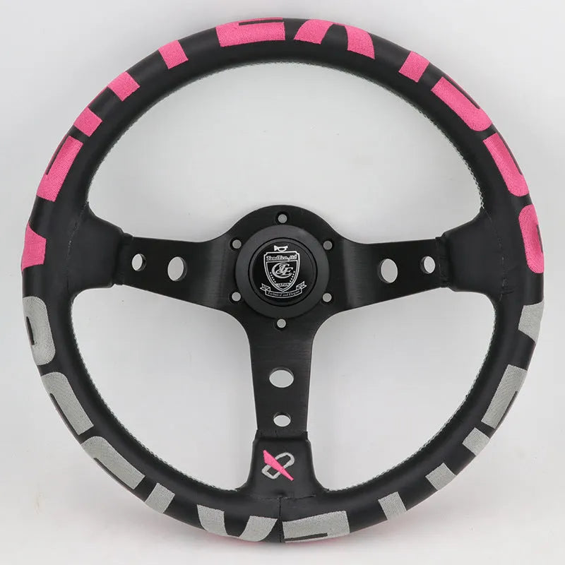 Black alloy racing steering wheel with deep concave rim and star embroidery pattern.