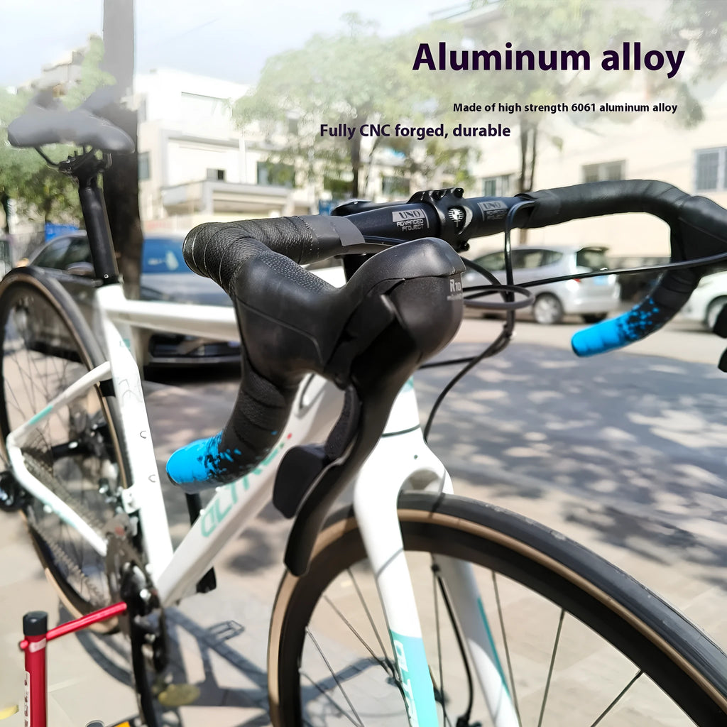 Black aluminium alloy road bike bent handlebar showing its curved shape and clamp area