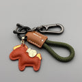 Handmade brown cowhide key ring pendant with zinc alloy pony buckle and green flanelle rope.