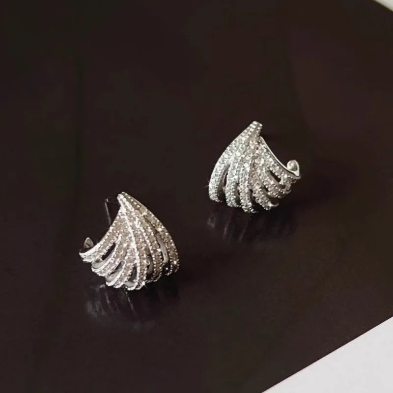 A pair of geometric line design drop earrings with a platinum colour finish.