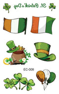 Single sheet of a green St. Patrick's Day clover temporary tattoo sticker, showing water-transfer paper backing.