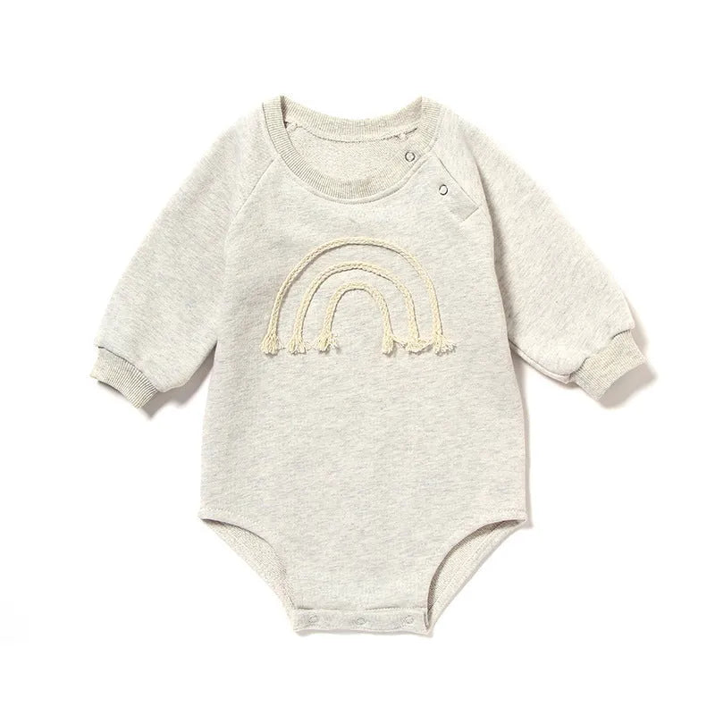 Baby wearing long sleeve waffle cotton romper with either cotton rope ties or button front closure in beige, khaki, green or blue