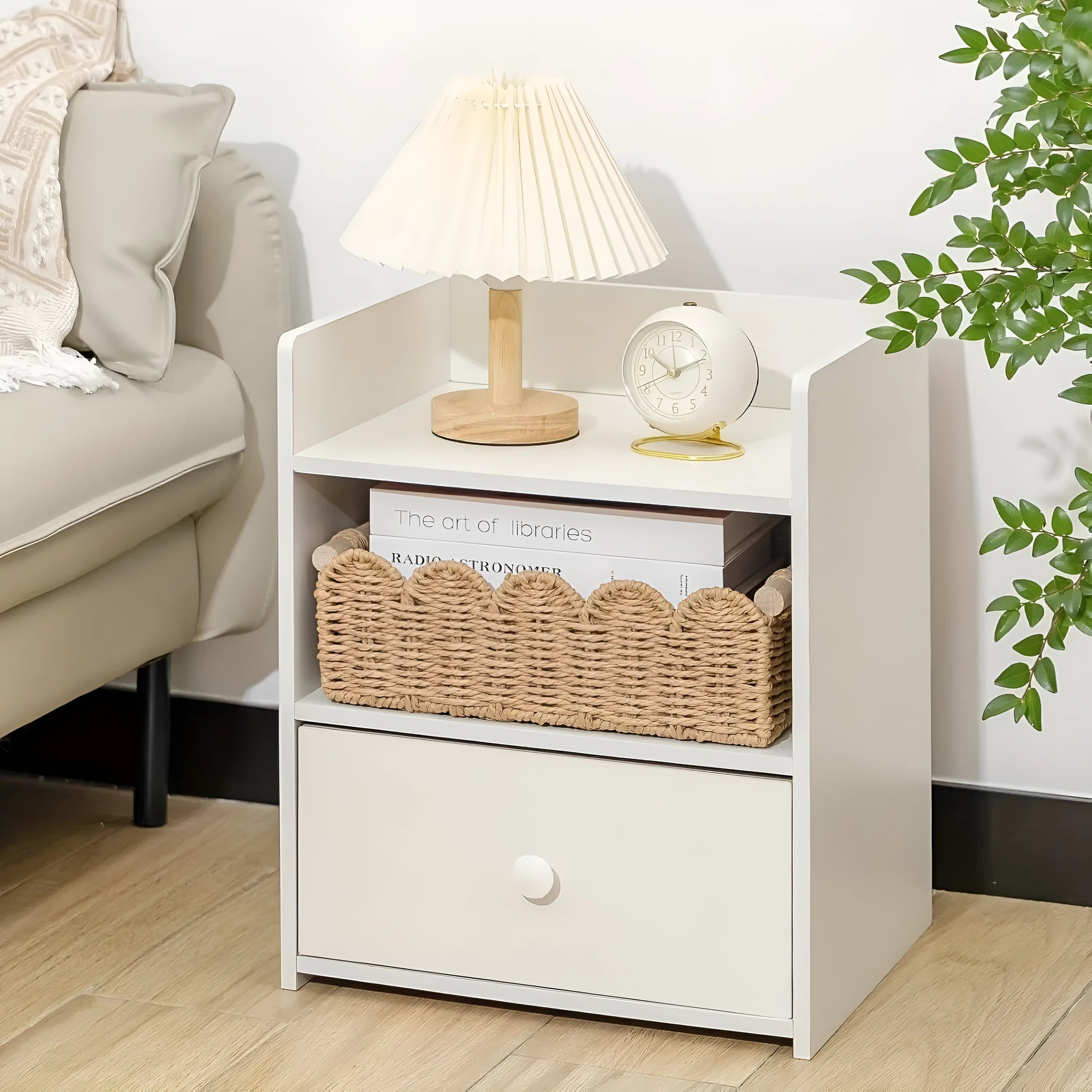 Modern minimalist woven paper storage basket on a desktop, holding remote controls and pens.