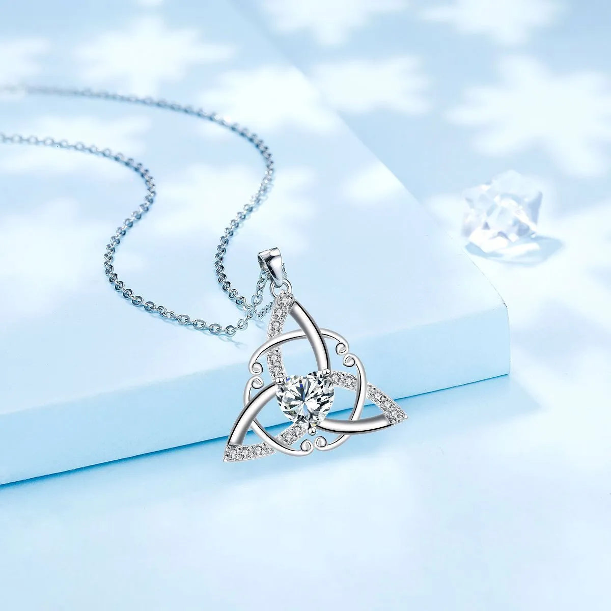 Geometric Celtic knot pendant necklace for women in copper with a choice of electroplated colour finishes.