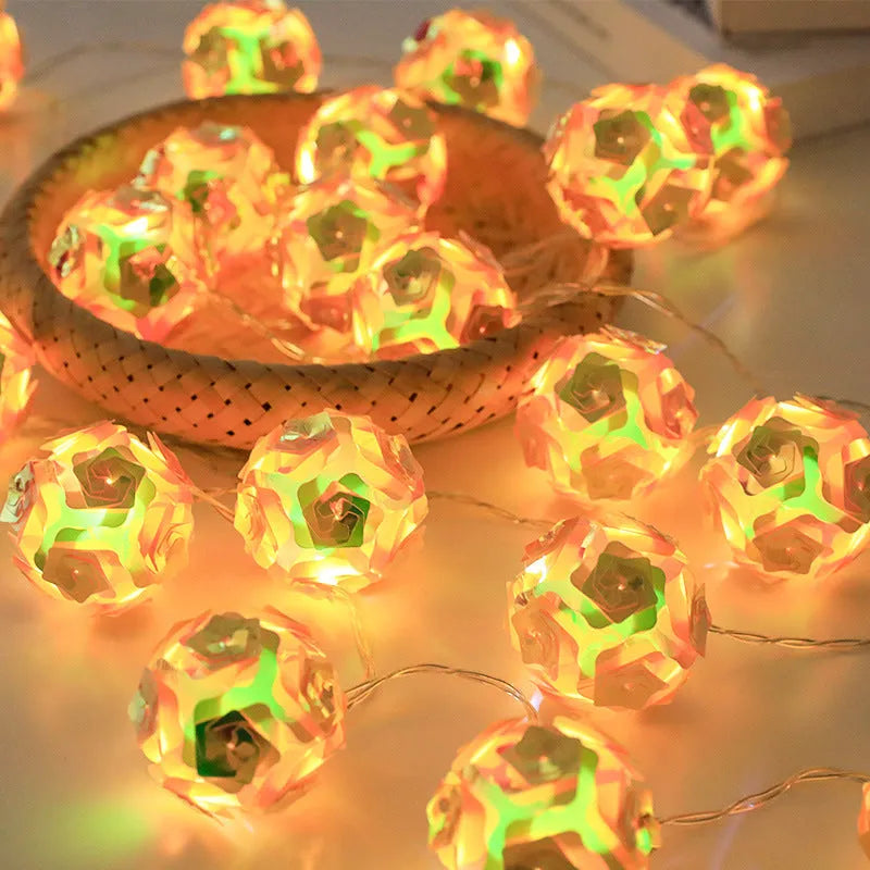 Laser rose windmill LED lamp string with crystal orange light colour on a dark background showing 5cm beads