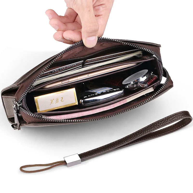 Men's genuine leather clutch wallet with litchi pattern embossing, anti-theft sandwich pocket, and removable handle in black