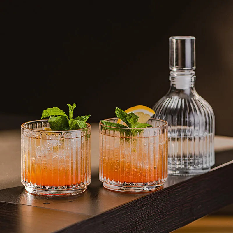 Clear glass whiskey wine glass with striped pattern on modern bar table