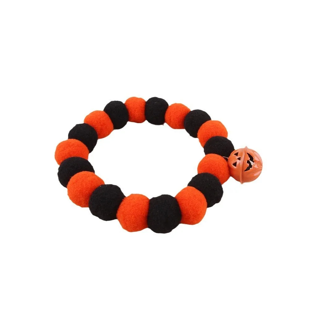 Halloween pumpkin pet collar with adjustable band, satin ribbon bow, and bell for cats and small dogs