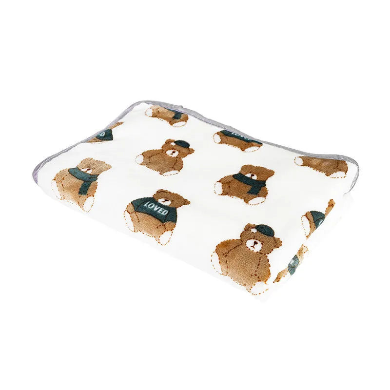 Soft warm pet blanket in pink for dogs and cats, size M, on a pet bed