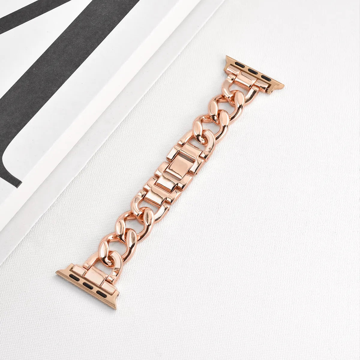 Metal denim chain Apple Watch strap in silver, black, gold, rose gold, and Starlight colours showing textured design