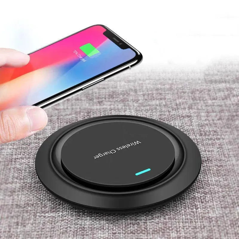 Circular white desktop wireless phone charger showing 10W fast charging capability and 7mm thickness