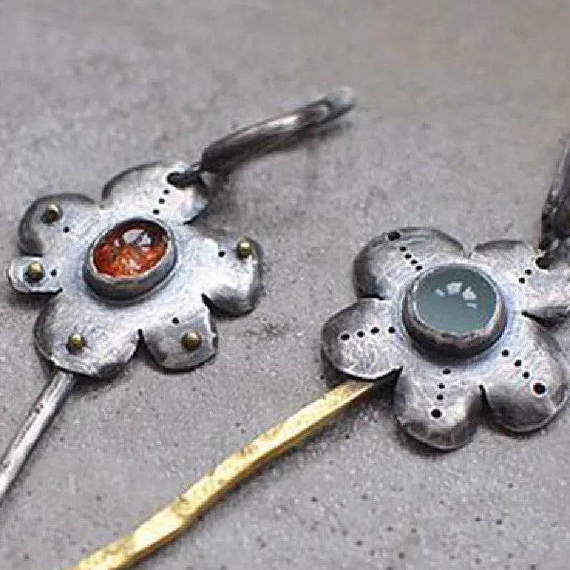 Long geometric flower earrings with two-tone asymmetrical colour on alloy metal.