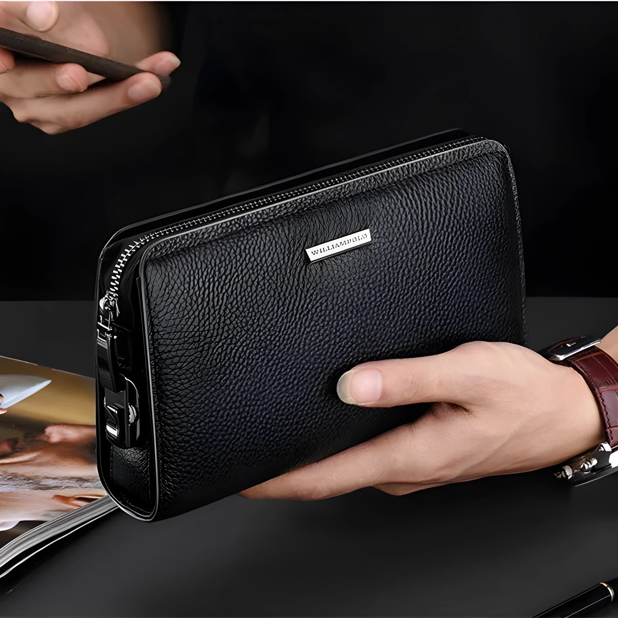 Men's genuine leather clutch wallet with litchi pattern embossing, anti-theft sandwich pocket, and removable handle in black