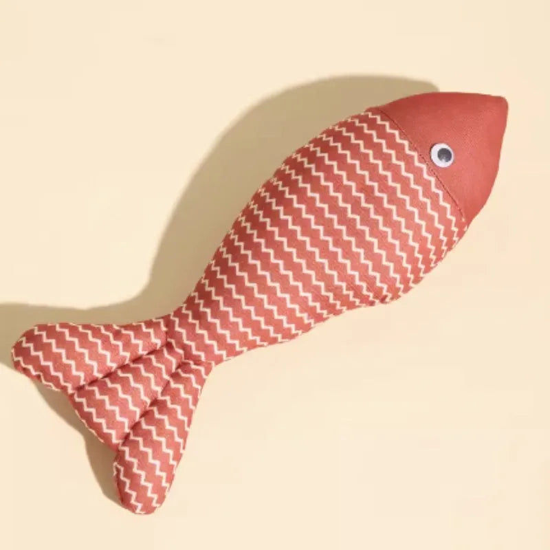 A blue, red, or yellow fabric fish-shaped cat toy filled with catnip, shown in large or medium sizes.