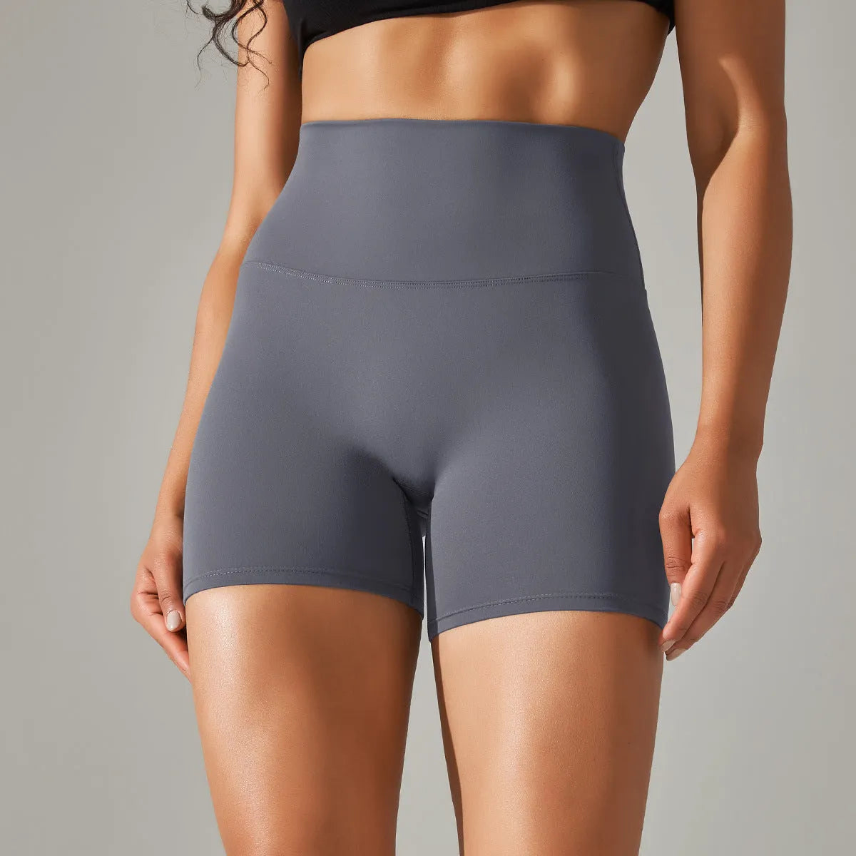 Women's high waist fitness pants in dark green with belly contracting design for sports and daily wear