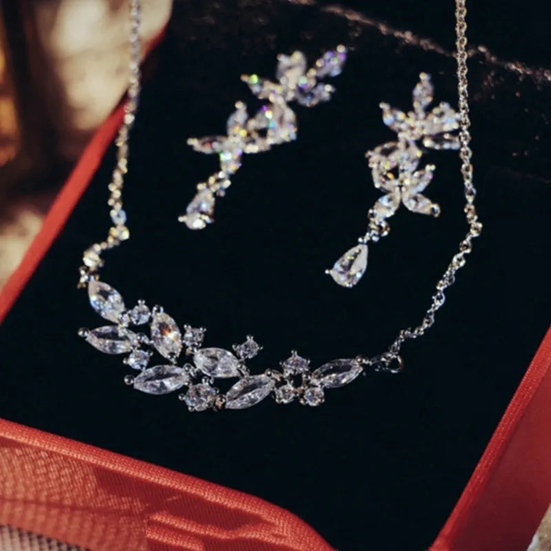Silver alloy necklace and earrings set with zircon leaf design for bridal weddings